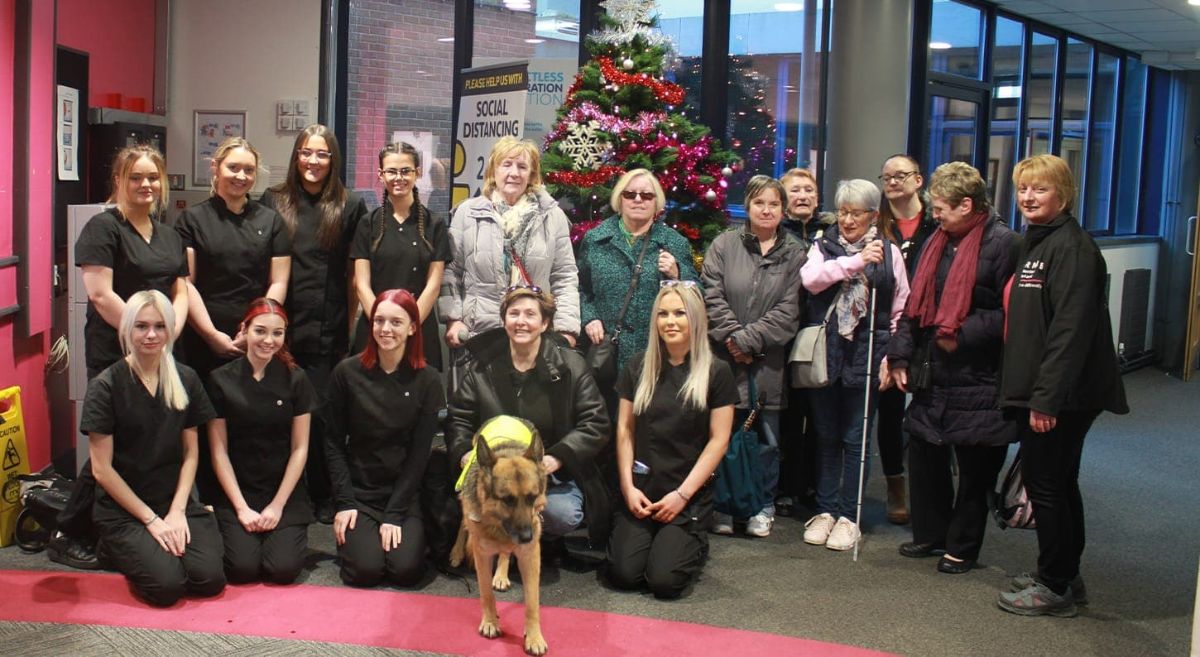 Bangor NVQ Level 3 Beauty Therapy students with clients from RNIB.